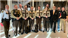 Several members of the Polk County Sheriff's Office pose together at the Government Center.