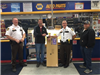 Polk County Sheriff Tadman and Chief Deputy Norland receive a donation from Napa Auto Parts.