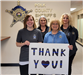 The Polk County Sheriff's Office records group holding a thank you sign.