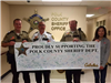 Officers Holding a Cabela's Employees Signed Poster