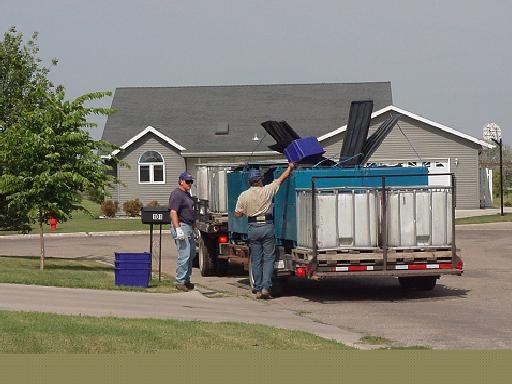 Men Picking up Curbside Recycling