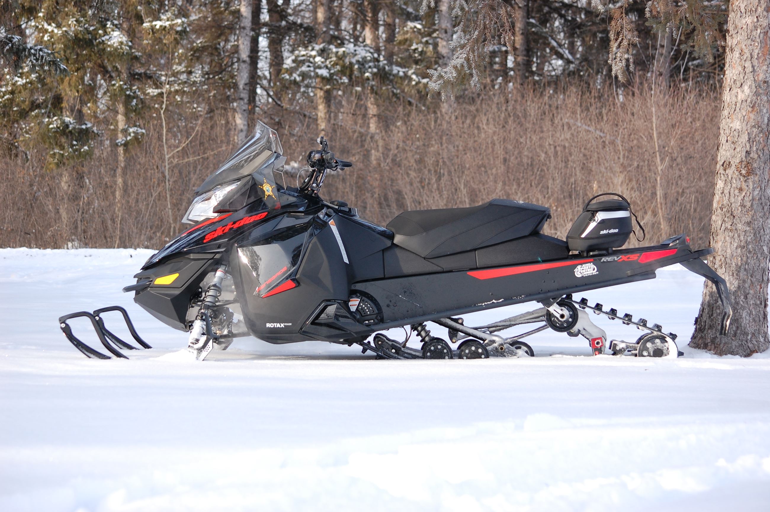 A Black Snowmobile on the Snow