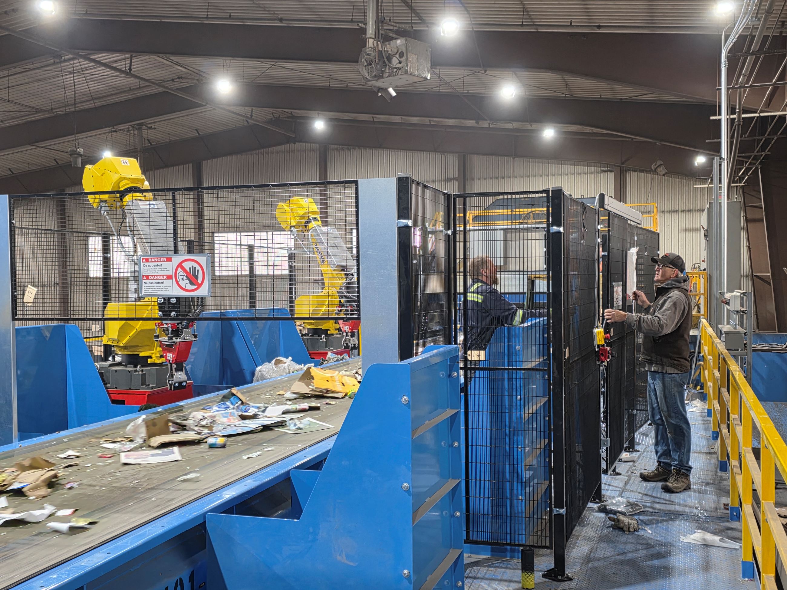 RRF staff installing robotic cage panels